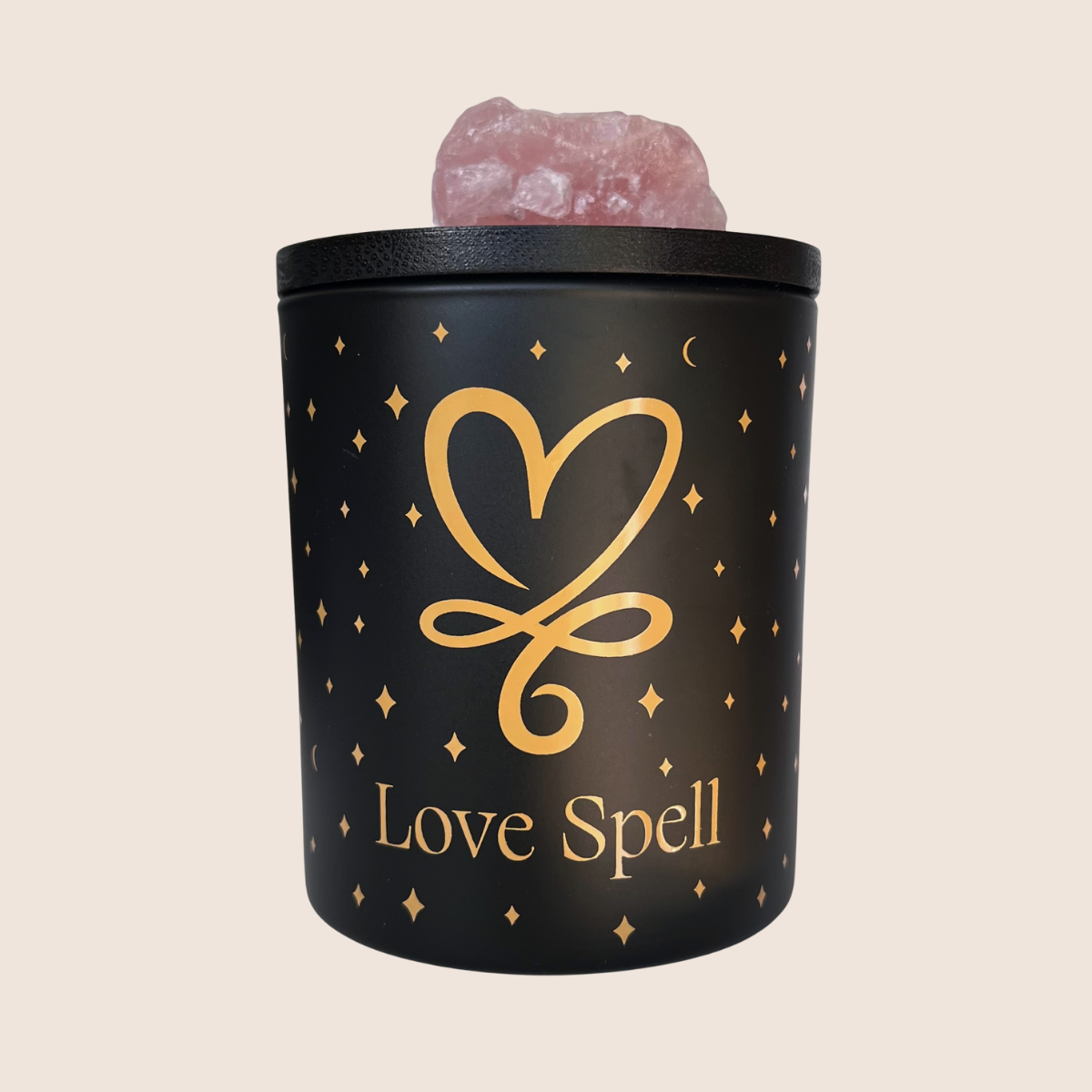 Love Spell, luxury candle, with heart icon and Rose Quartz Crystal on lid.