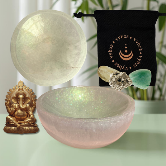 Emerald green tinted selenite crystal bowl, side and top view, black pouch with Citrine, pyrite and green aventurine crystals.