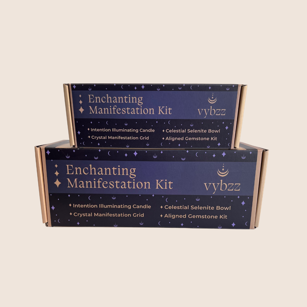 Premium and essential sized Enchanting Manifestation Kit gift boxes with soy candle, selenite bowl, and gemstone kit.