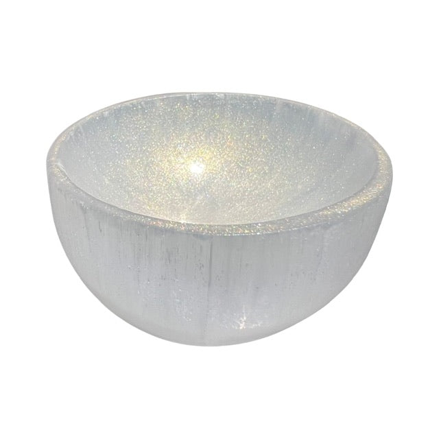 The top view of a selenite crystal bowl, hand adorned with shimmering gold, fairy dust.