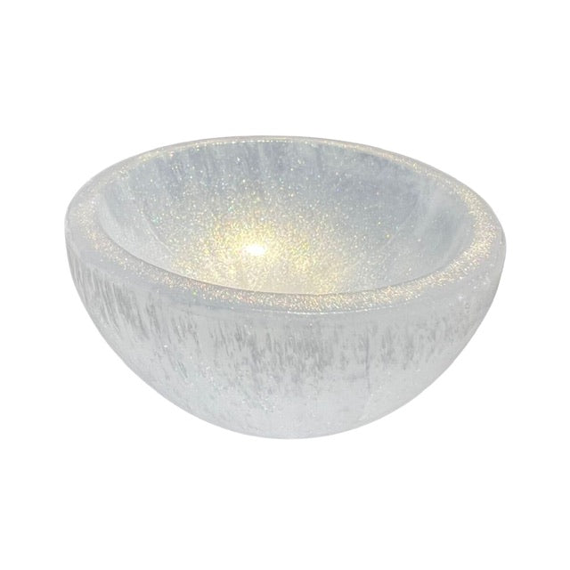 The top view of a petite selenite crystal bowl, hand adorned with shimmering gold, fairy dust.