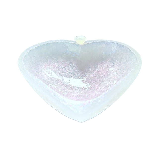A unique selenite heart bowl with hand-painted soft pink shimmering patina and a petite rose quartz heart. 