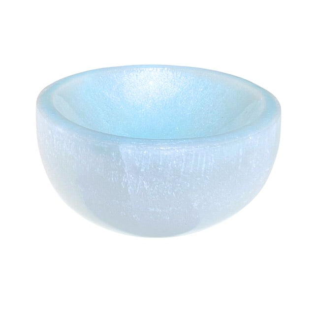 The top view of an opalescent selenite crystal bowl, hand adorned with a sky blue finish.