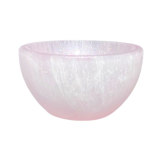 A petite selenite crystal bowl, the inside is hand-painted with a shimmering pink finish.