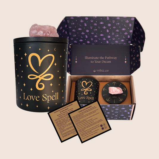 Intention Illuminating soy candle, scented for Love Spell, with Rose Quartz crystal, displayed in branded gift box with information cards.