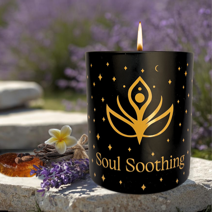 Lit aromatherapy candle labeled 'Soul Soothing' with lavender, oils, and a flower outdoors
