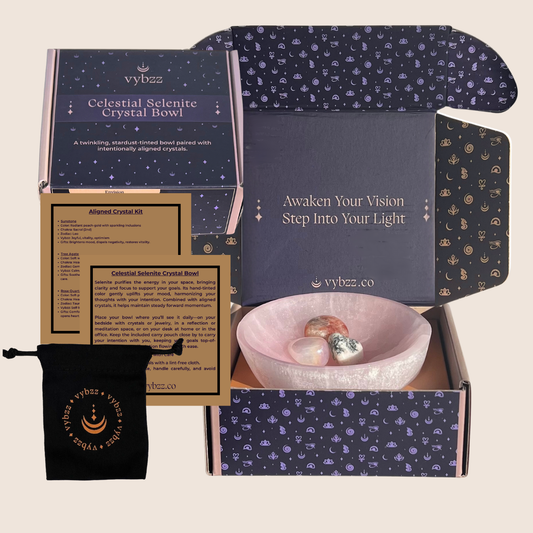 Vybzz Soul Soothing Celestial Selenite Crystal Bowl tinted ruby shimmer  with rose quartz aura, tree agate and sunstone crystals. Shown in branded box with product information cards.