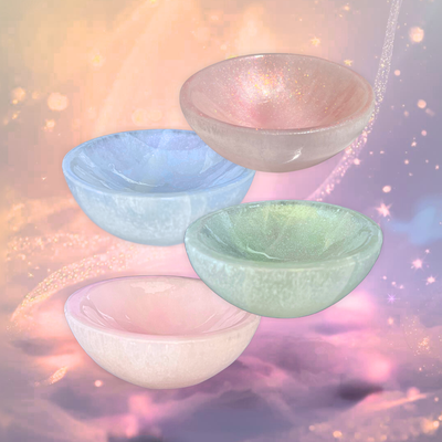 Hand-tinted luminous selenite crystal bowls ruby, emerald, sky blue, and blush.