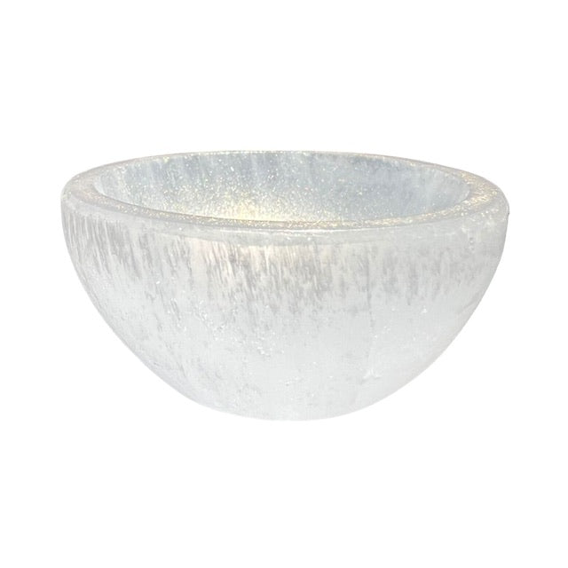 A petite selenite crystal bowl, hand adorned with shimmering gold, fairy dust.