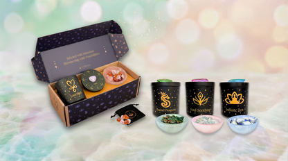 Open Essential-size Manifestation Kit gift box featuring Love Spell Aromatherapy Intention Candle, crystal grid, and Selenite Bowl with crystals; other kits include Channel Prosperity, Soul Soothing, and Infinite Zen.